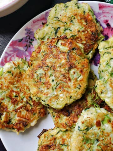 A plate with courgette fritters
