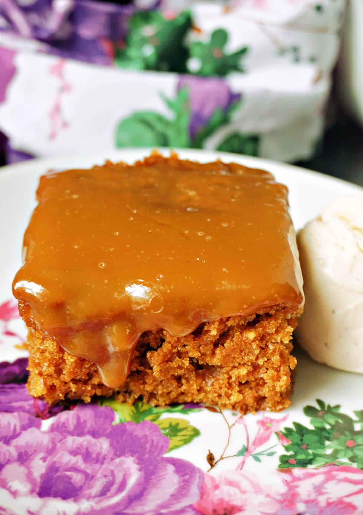 A slice of sticky toffee pudding on a plate.