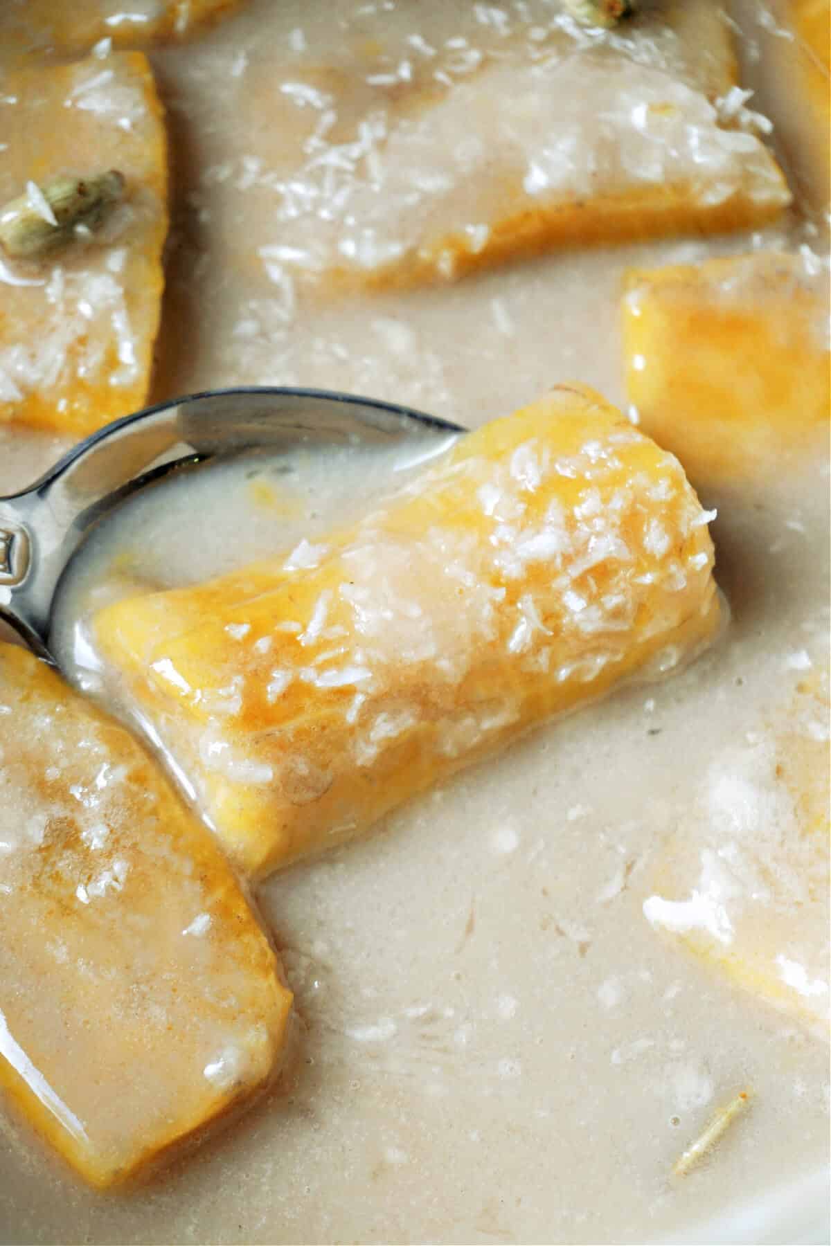 Close-up shoot of plantain slices in coconut milk.