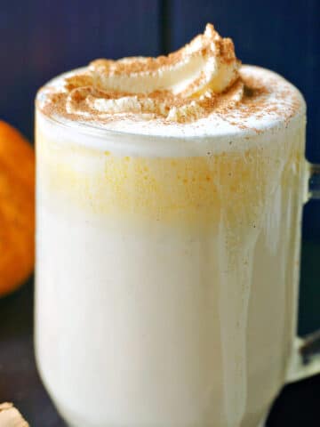 A glass of pumpkin white hot chocolate.