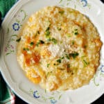 A white plate with butternut squash risotto.