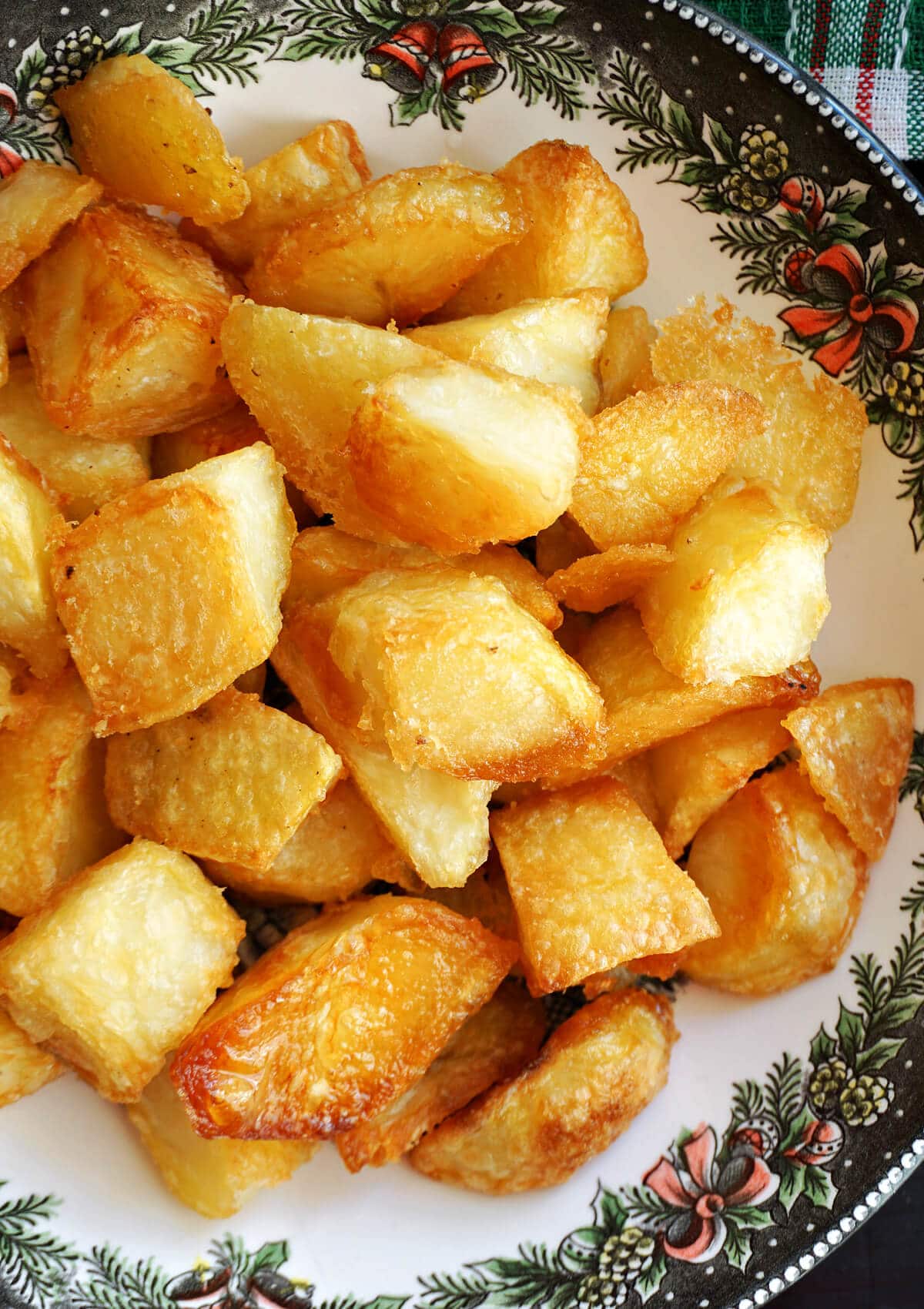 A bowl with roast potatoes.