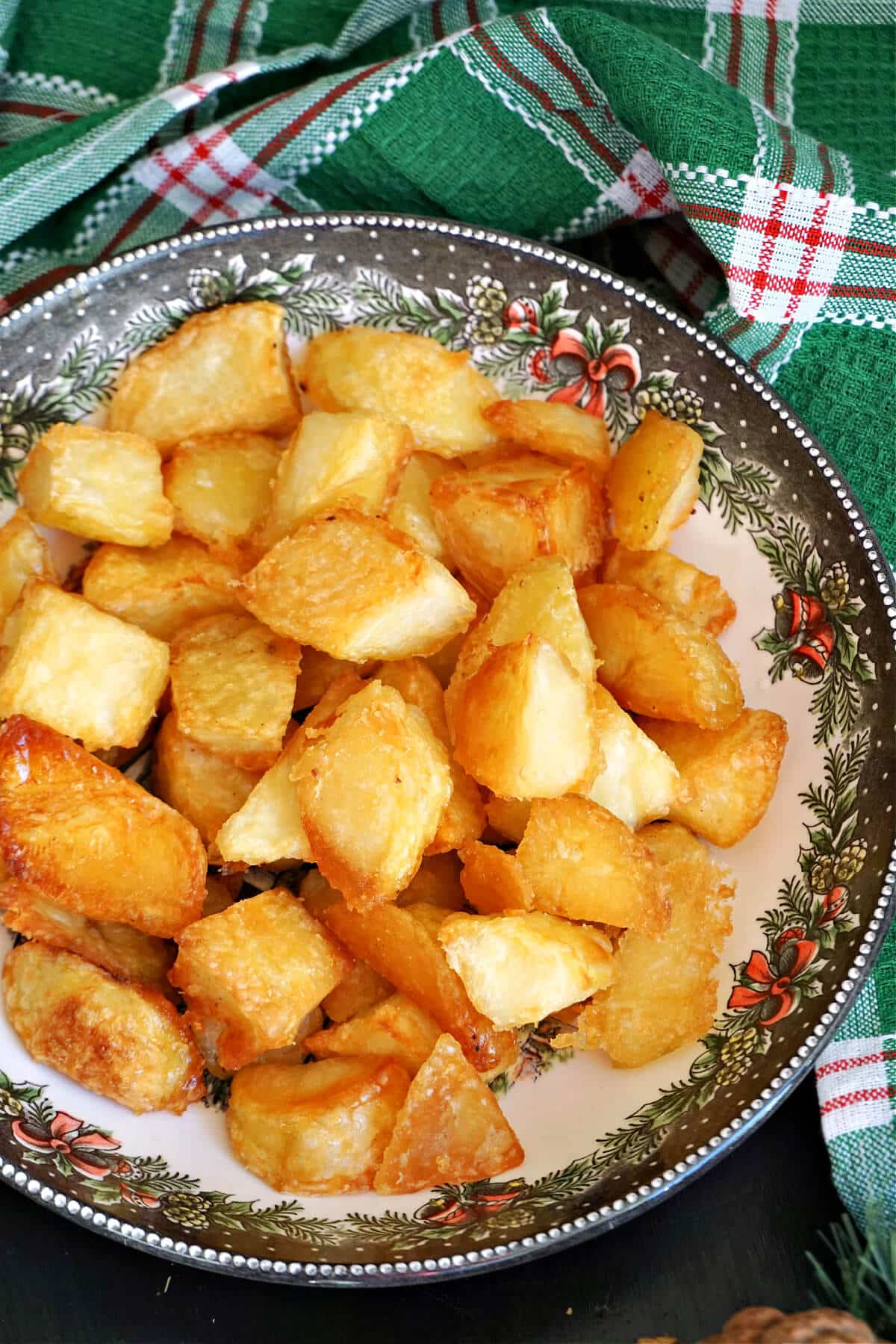 A bowl with roast potatoes.