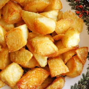 A bowl with roast potatoes.
