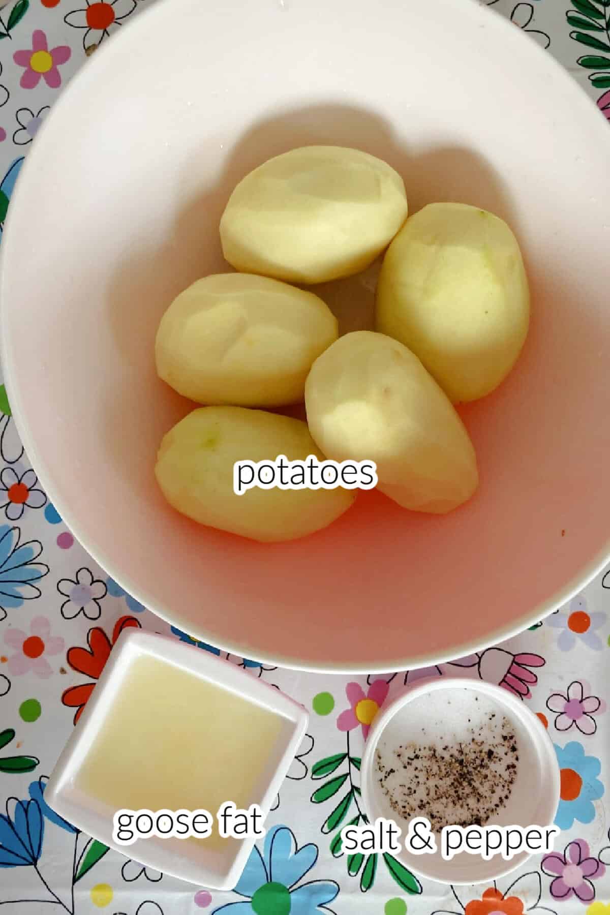 Ingredients needed to make roast potatoes with goose fat.