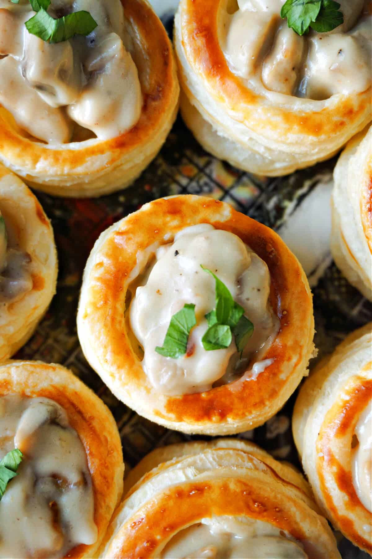 Overhead shoot of 8 vol-au-vents filled with chicken and mushrooms.