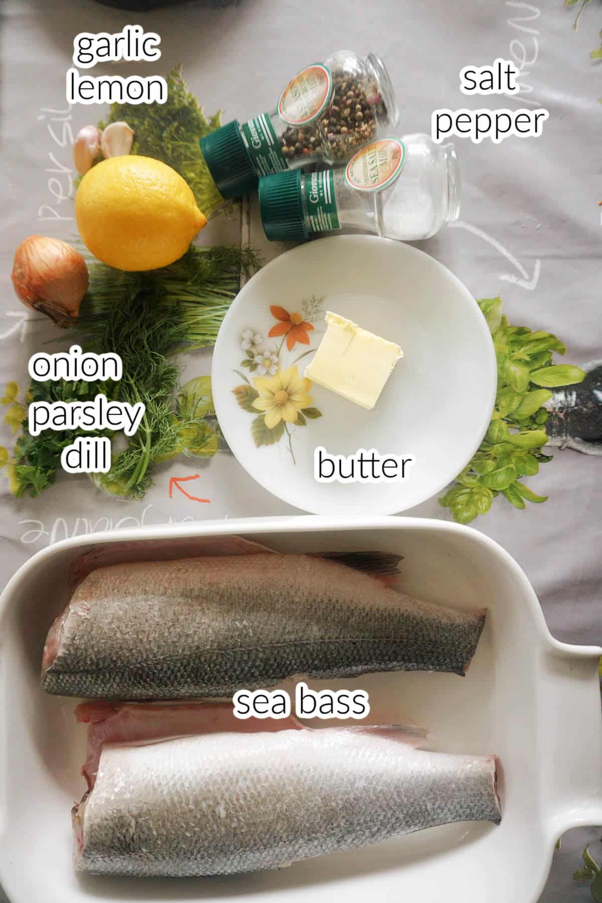 Ingredients needed to make sea bass with lemon garlic butter sauce.