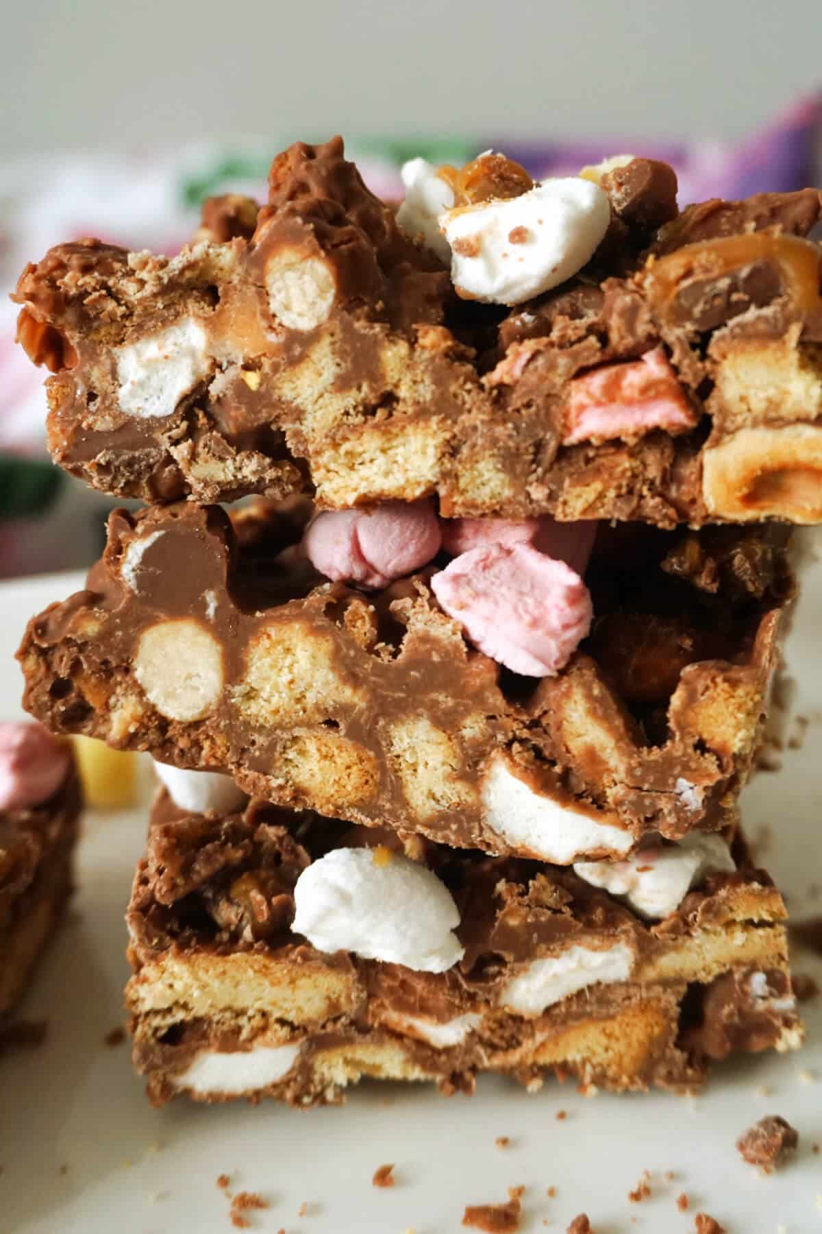 A stack of 3 slices of rocky road.