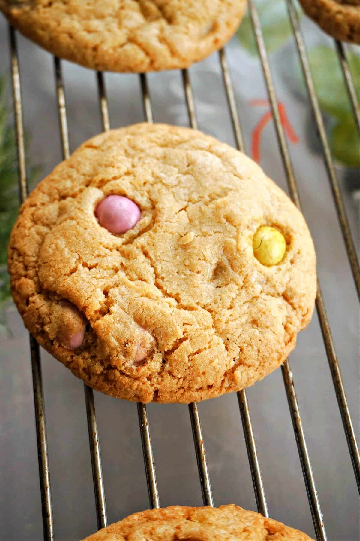 A mini egg cookie on a cooling rack.
