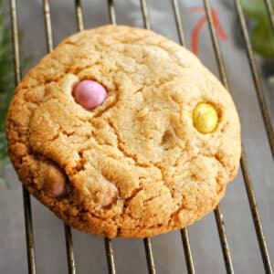 A chocolate egg cookie on a cooling rack.