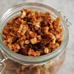 A glass jar with granola.