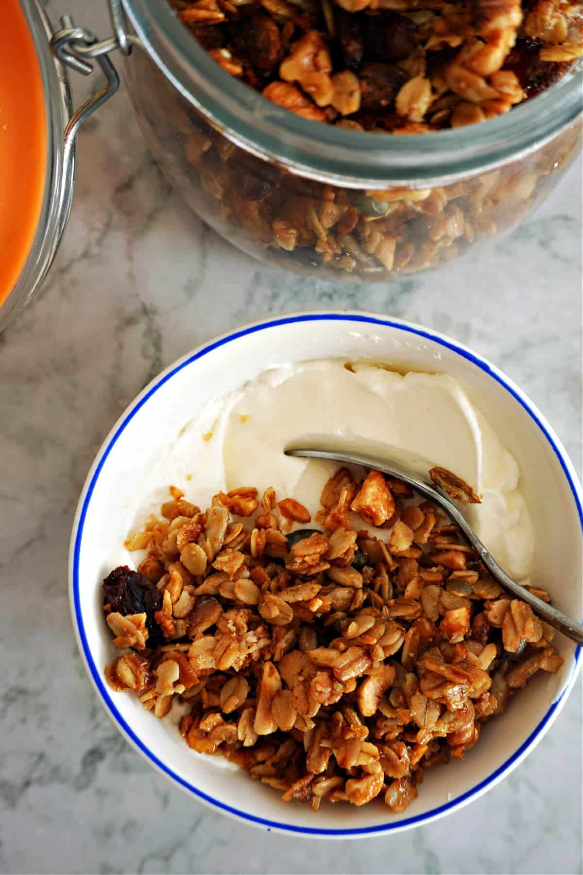 Overhead shoot of a small with yogurt and granola.