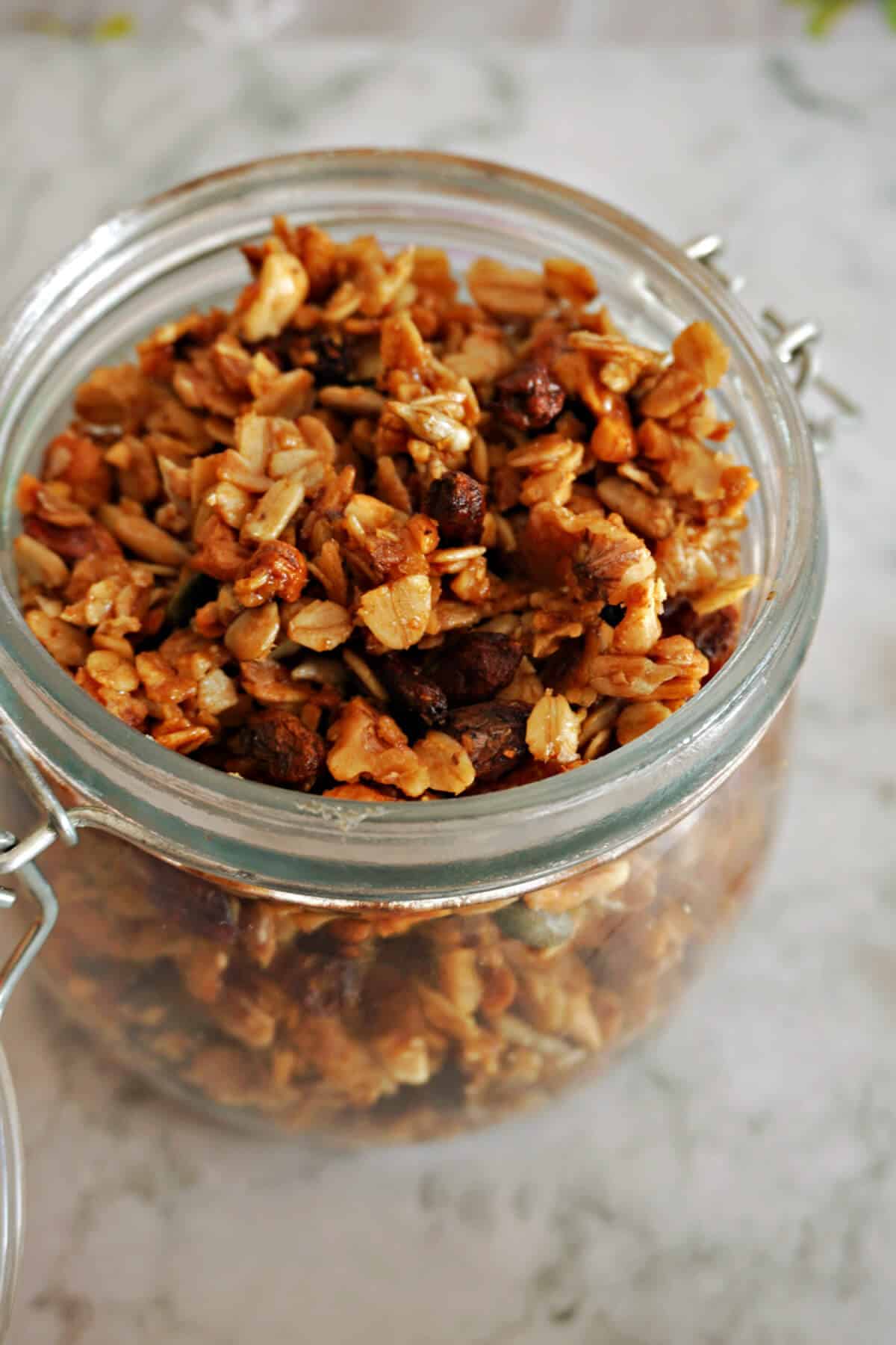 A glass jar with homemade granola.