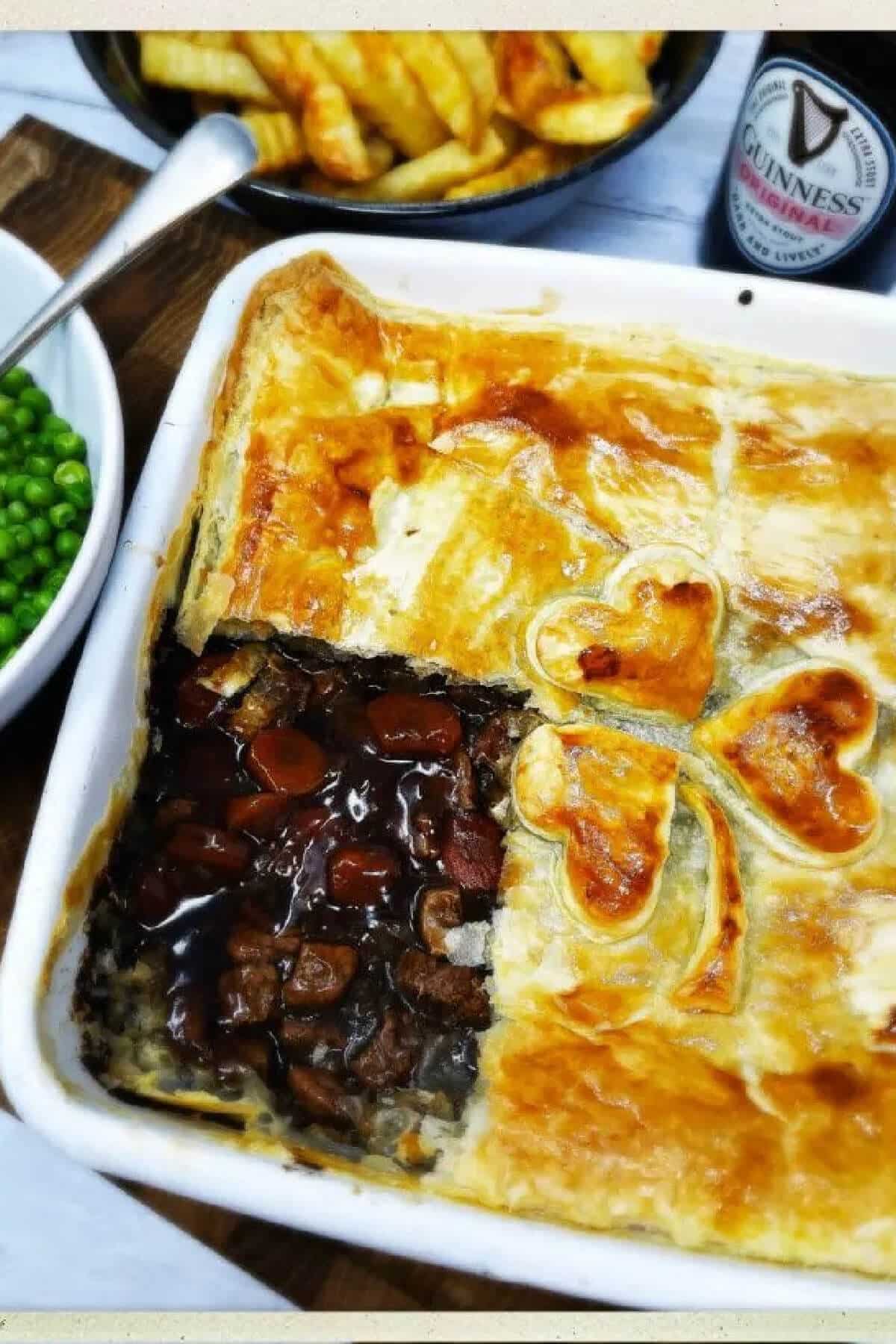 A steak pie in a white dish.