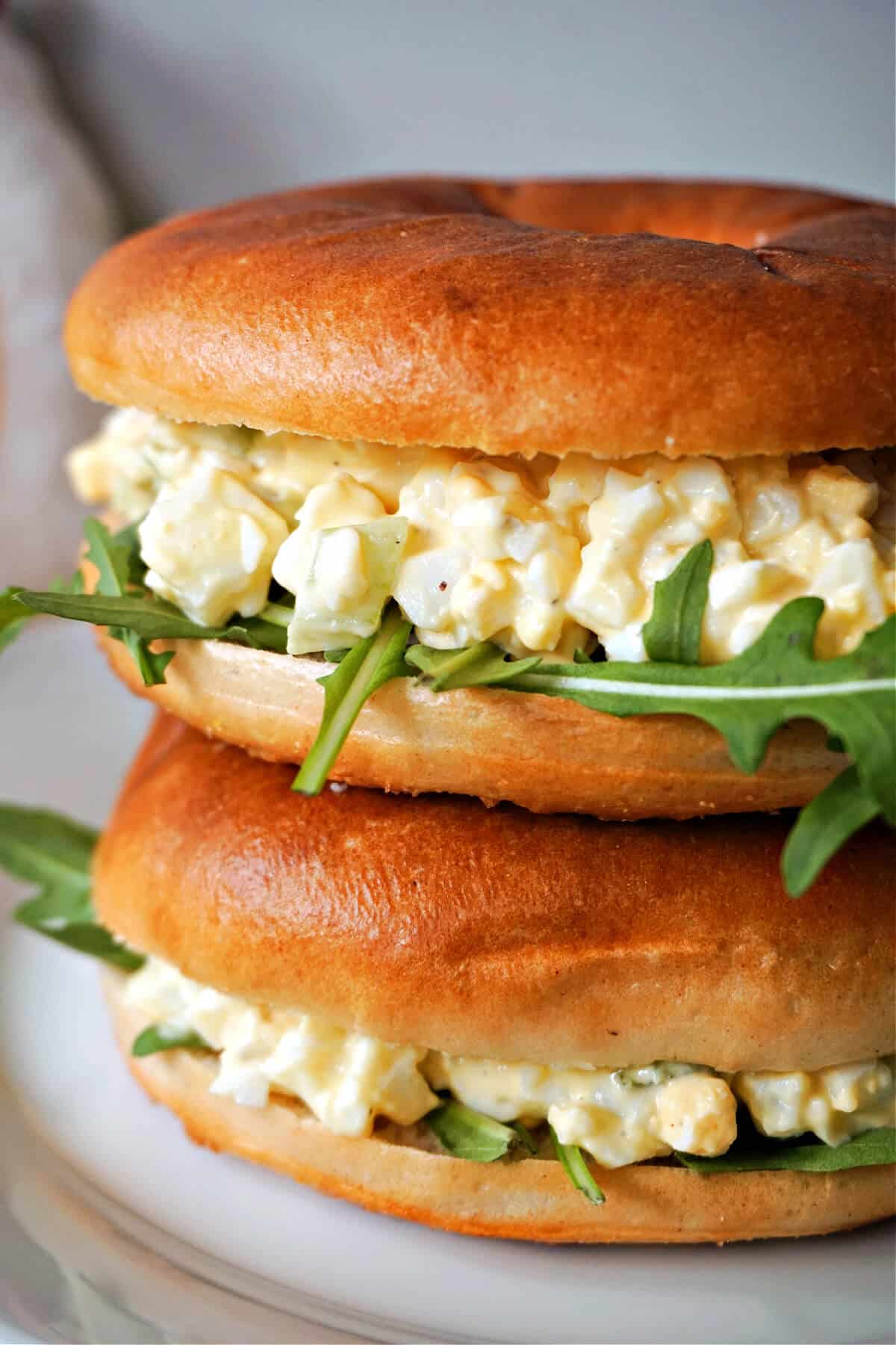 A stack of 2 egg sandwiches.