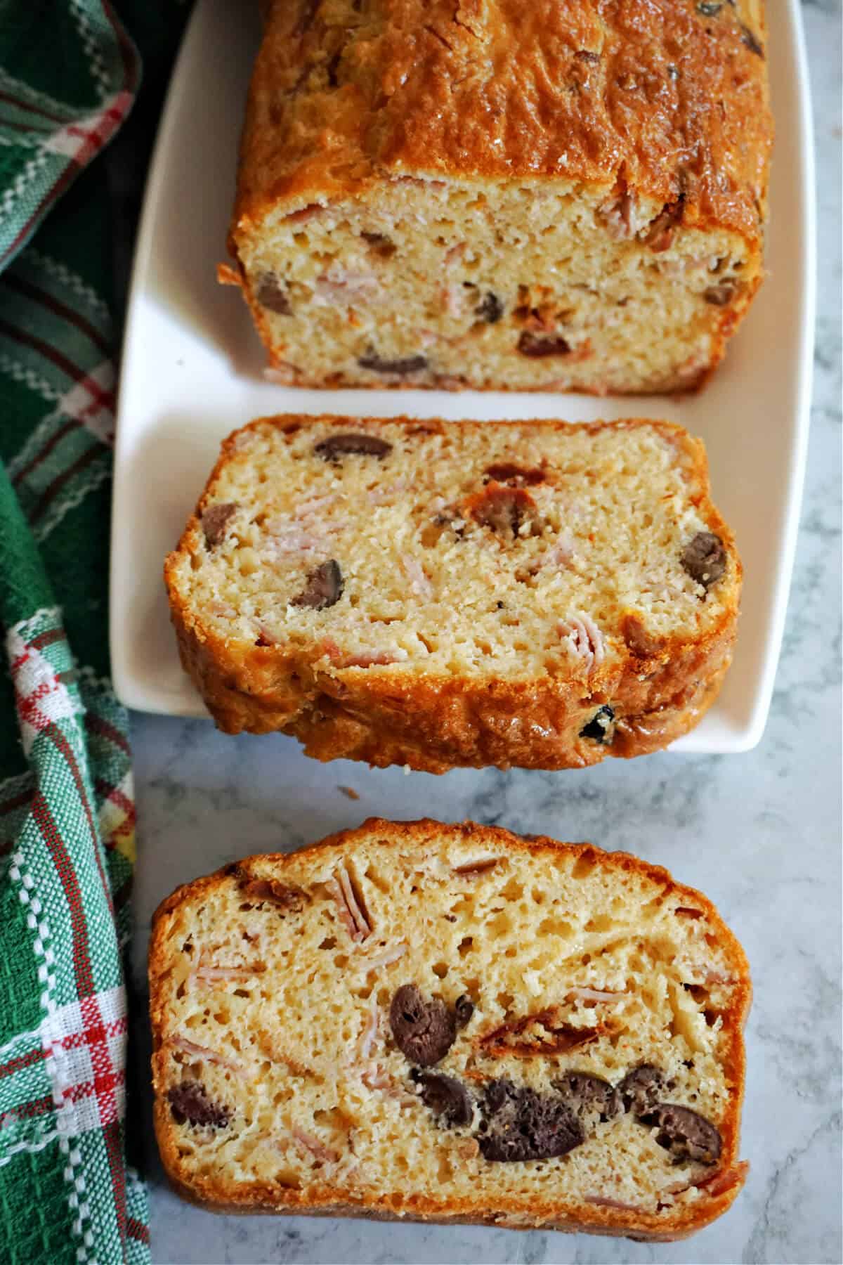 3 slices of loaf with olive slices in.