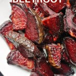 A white plate with roasted beets.