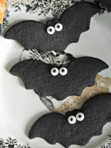 3 bat cookies on a Halloween plate.