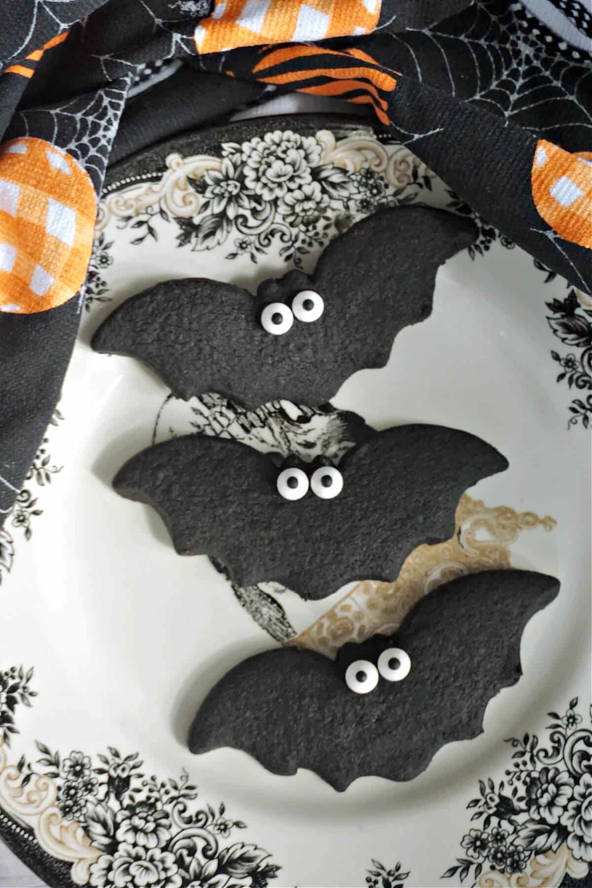 3 bat cookies on a Halloween plate.