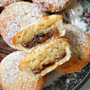 2 halves of a frangipane mince pie on top of other pies.