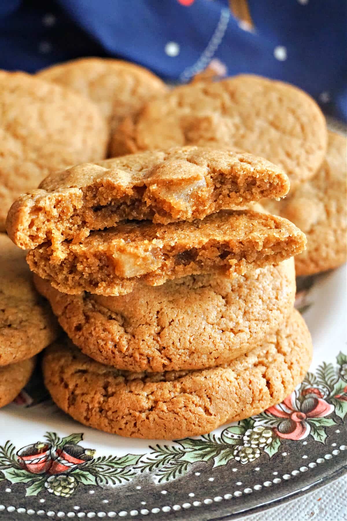 A stack of cookies with 2 cookie halves on top.