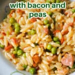 A plate with orzo with bacon and peas.