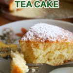 A slice of sponge cake on a white plate.