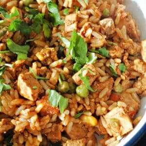 A white bowl with leftover roast pork fried rice.