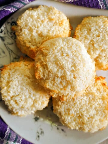 Coconut macaroons on a white plate.