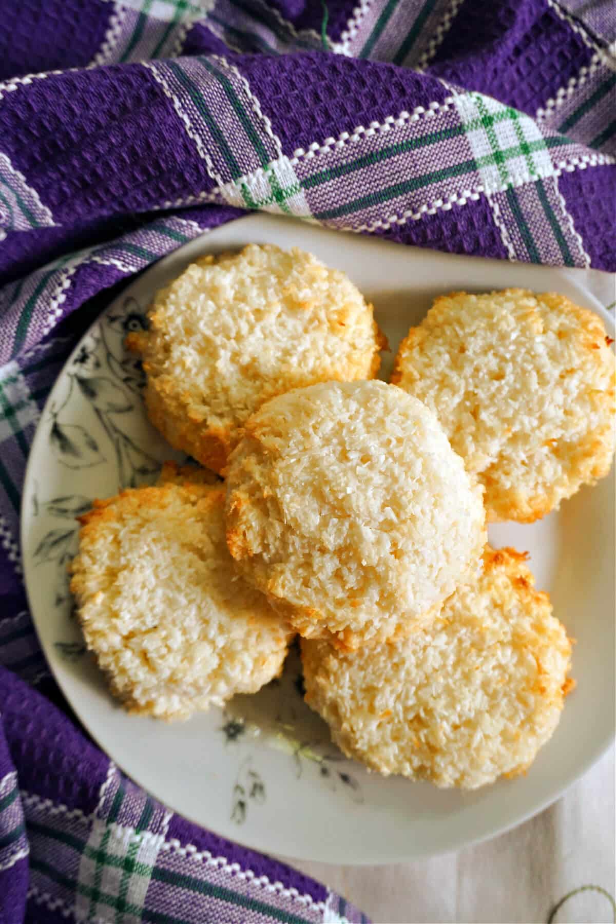 Coconut macaroons on a white plate.