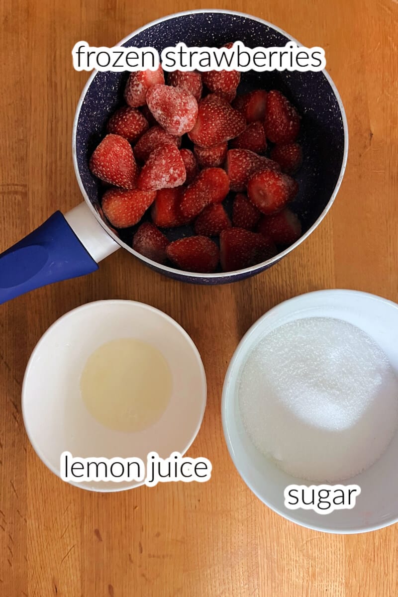 Ingredients to make strawberry jam.