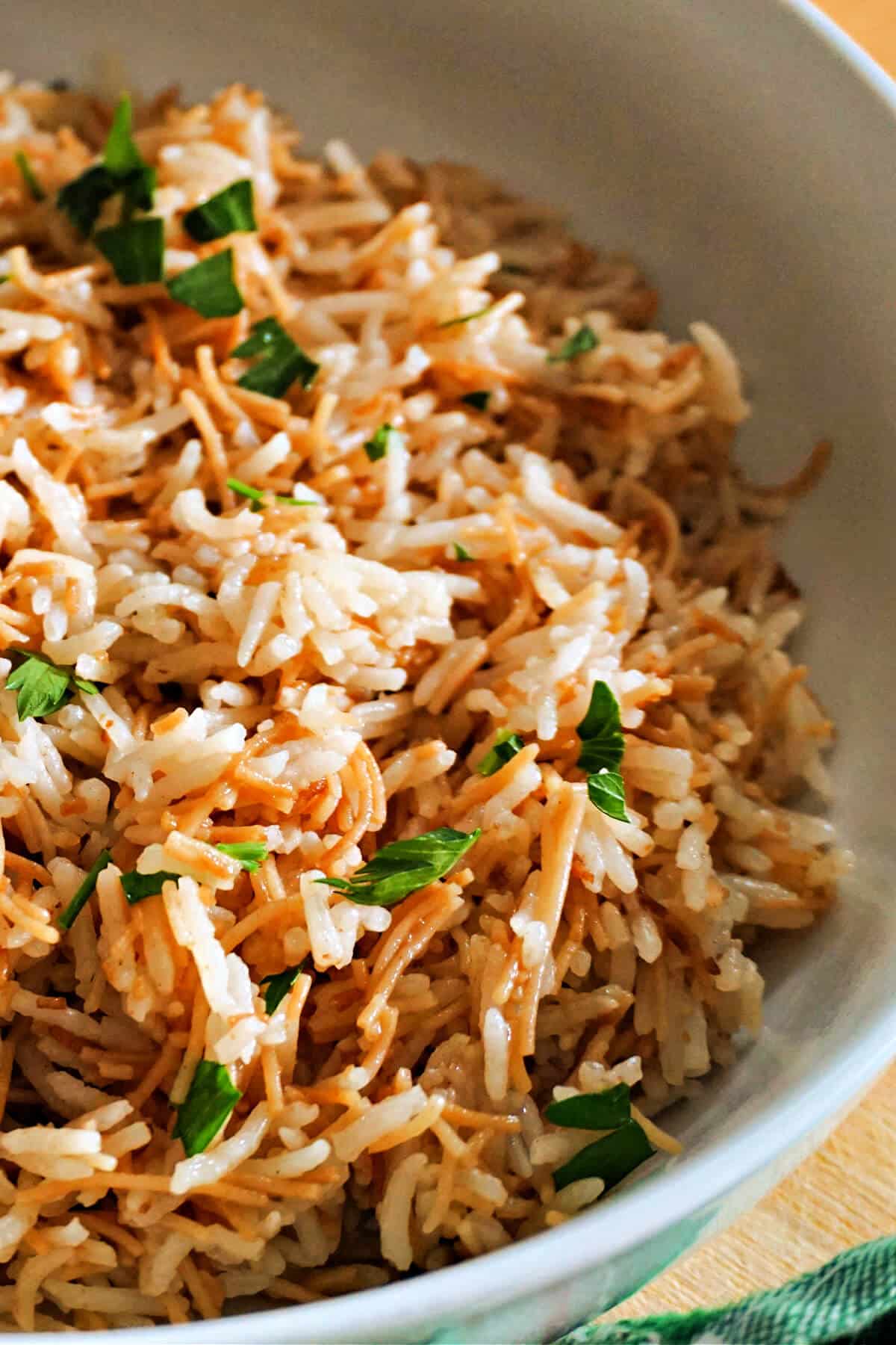 A portion of rice with vermicelli in a white bowl.