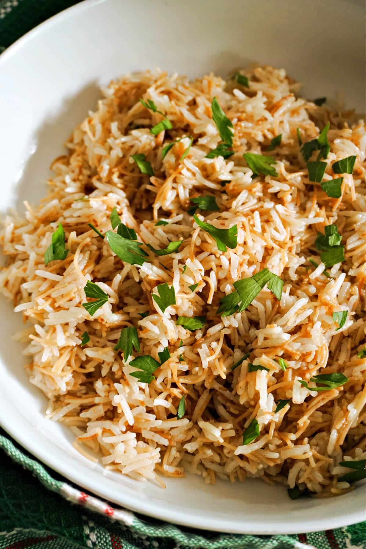 A portion of rice with vermicelli in a white bowl.