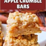 A stack of 2 apple crumble bars on a white plate.