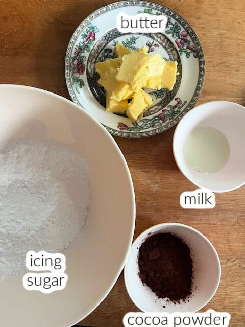 Ingredients used to make chocolate buttercream frosting.