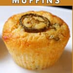 A cornbread muffin topped with a slice of jalapeno.