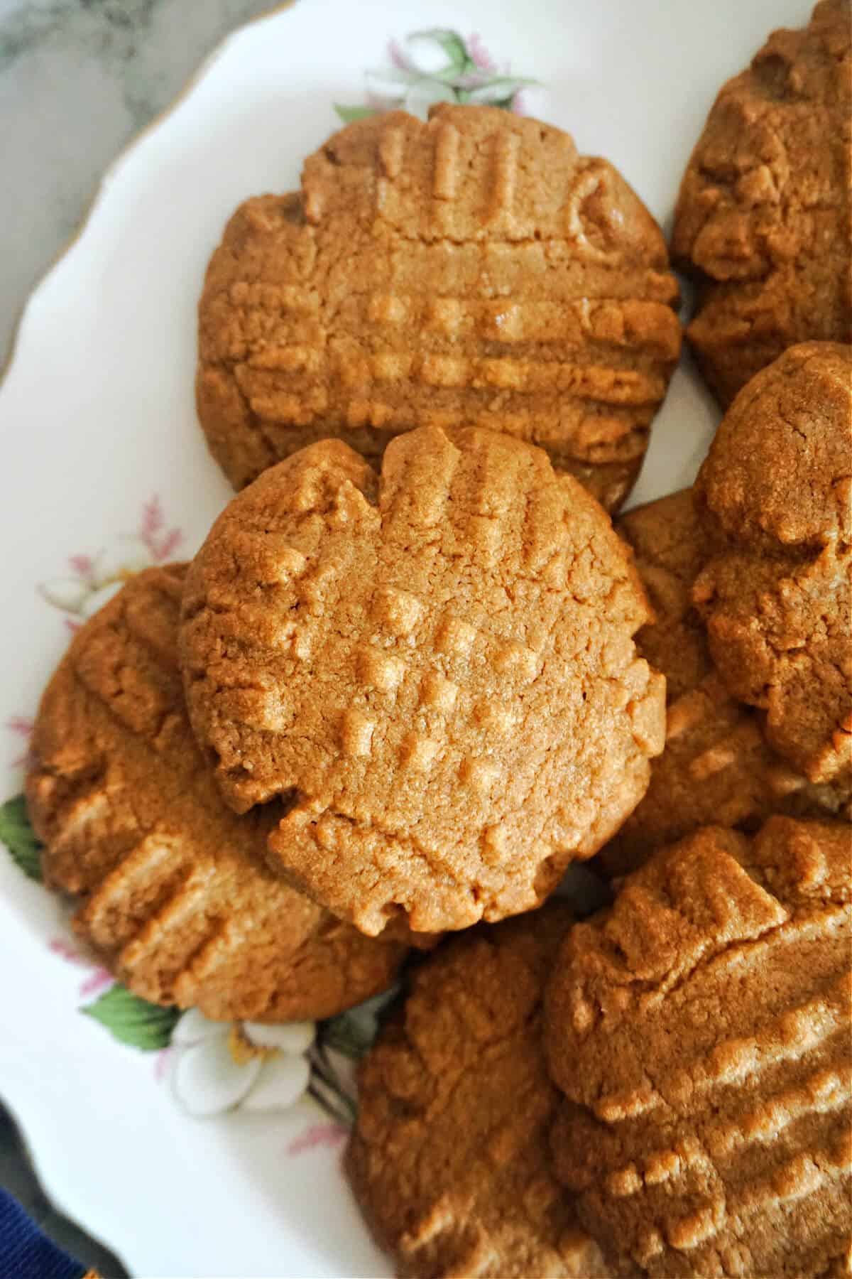 A partially visible white plate with biscoff cookies.