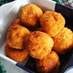 A serving bowl with fried crab balls.