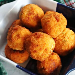 A serving bowl with fried crab balls.