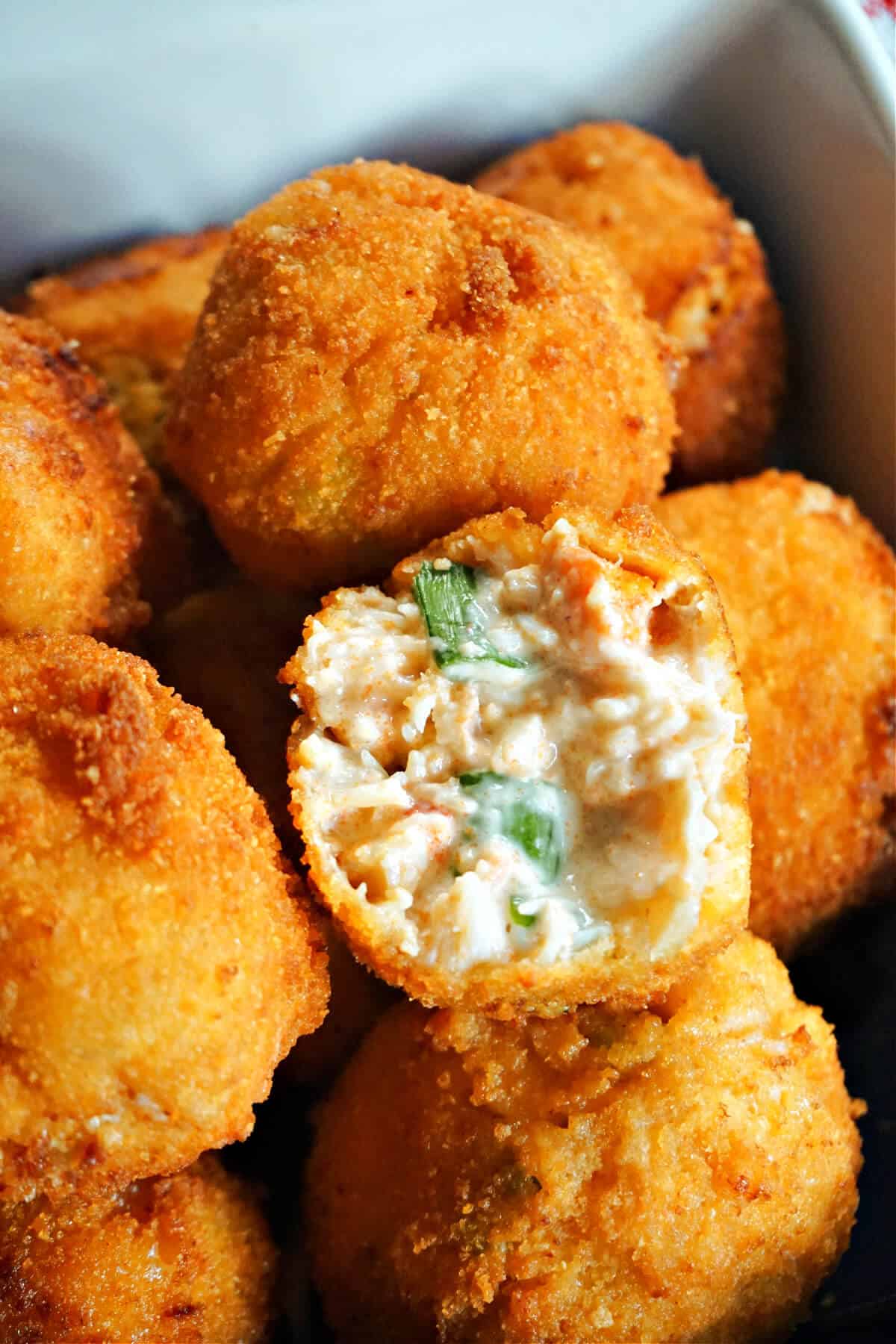 Half a crab ball on top of other crab balls.