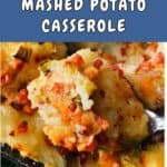 A spoonful of loaded mashed potatoes over a potato cassrole.