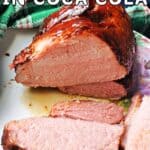 A sliced ham joint on a plate.
