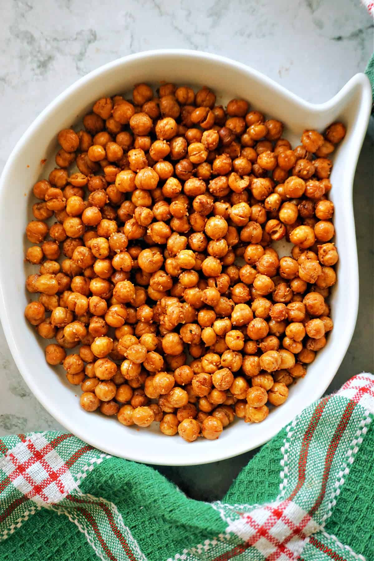 A white bowl with chickpeas.