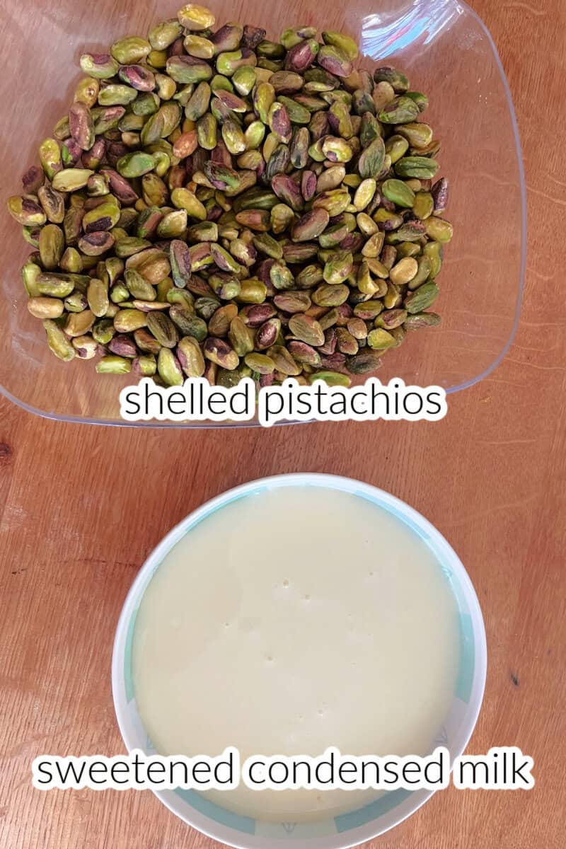 A bowl with condensed milk and another bowl with shelled pistachios.