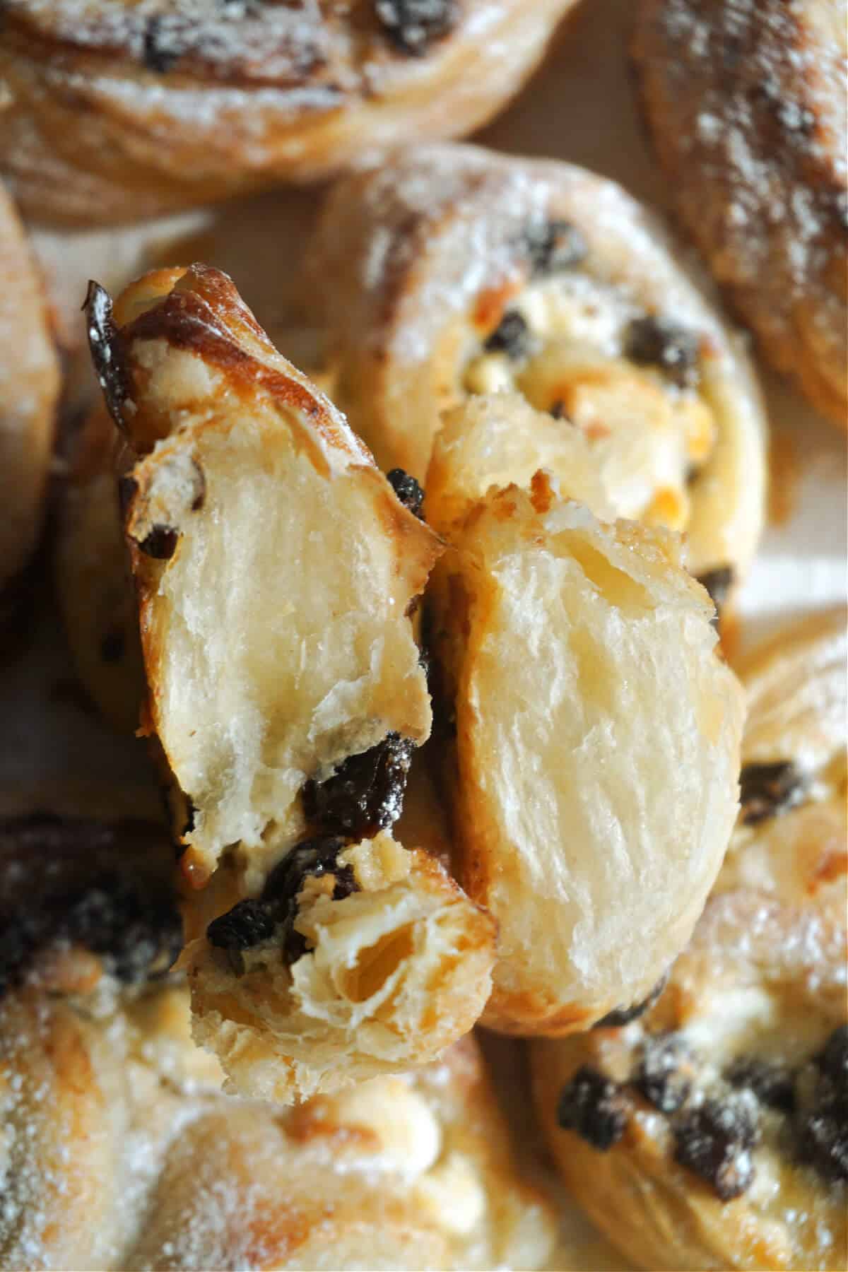 2 halves of s puff pastry palmier.