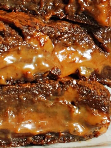 A stack of caramel brownie bars.
