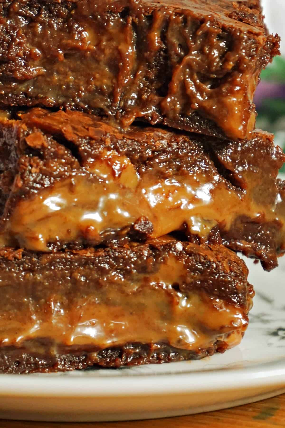 A stack of 3 bars of caramel brownies.
