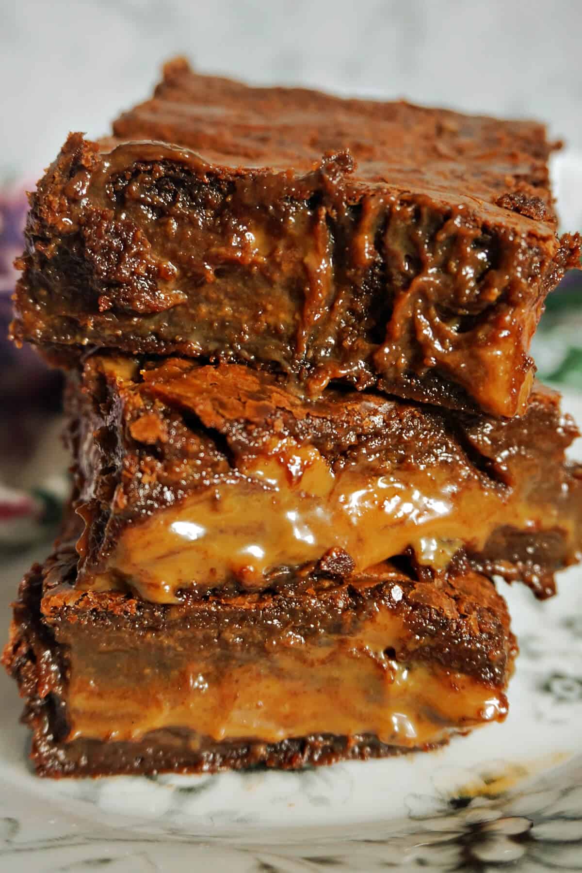 A stack of 3 bars of caramel brownies.