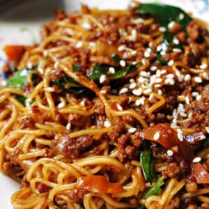 Close-up portion of ground beef and veggie stir fry noodles.