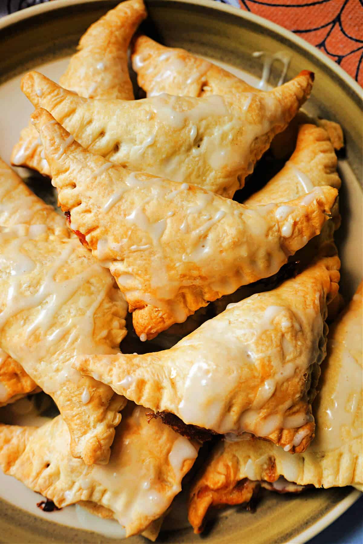 Golden turnovers on a plate.